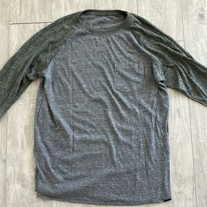 On the Byas. Medium. Dark Green and gray Baseball shirt. 3/4 sleeve
